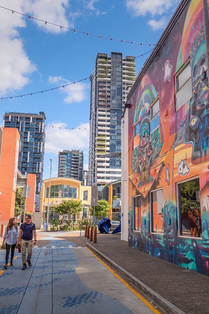 Melbourne street with colorful mural and modern buildings