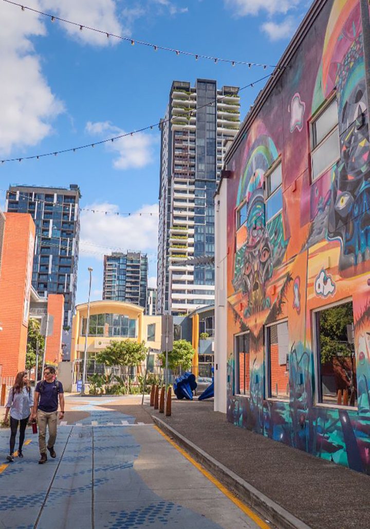 Melbourne street with colorful mural and modern buildings